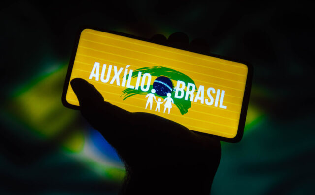 In this photo illustration a Auxílio Brasil logo is seen